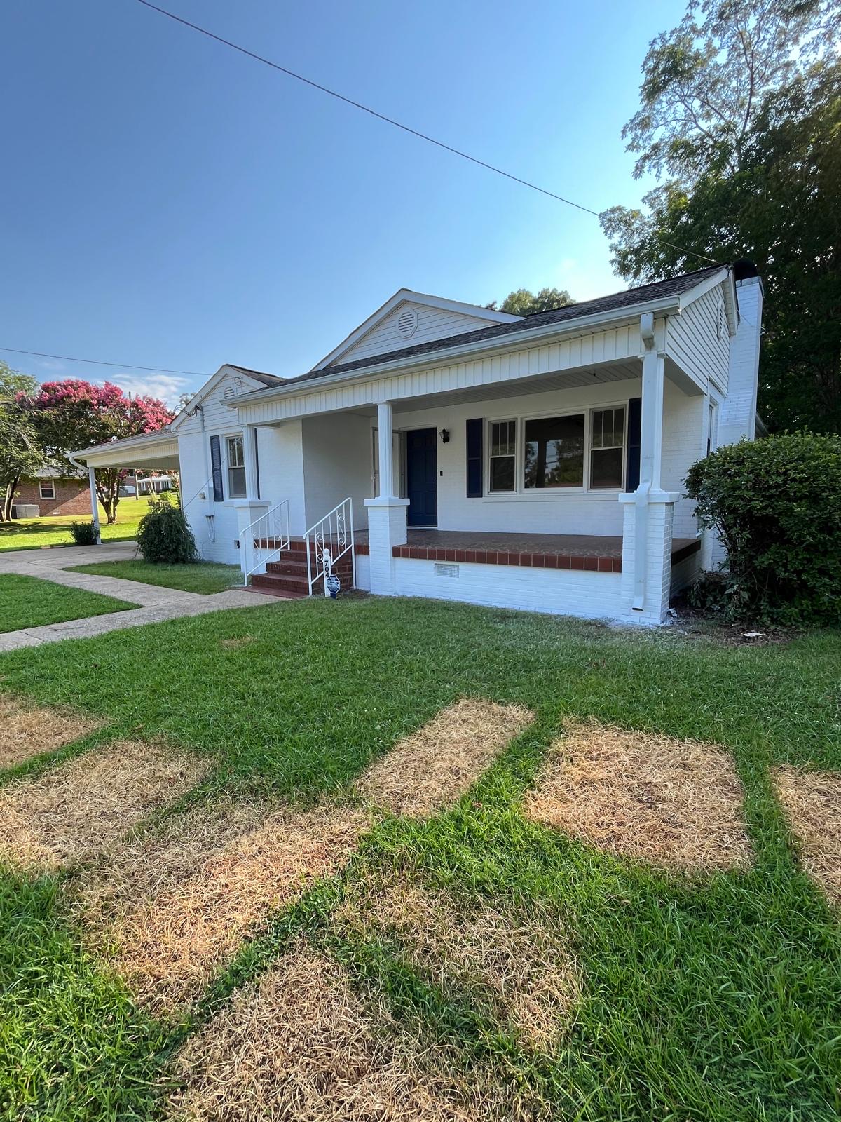 Full exterior repaint on a brick home